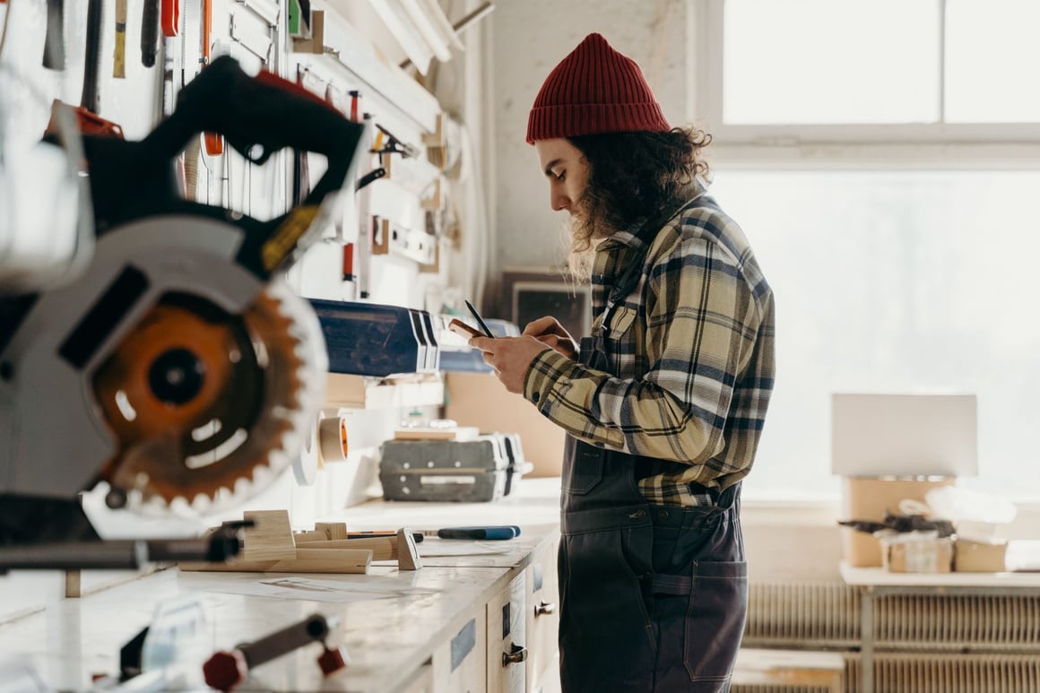 A pro checking a phone in a workshop